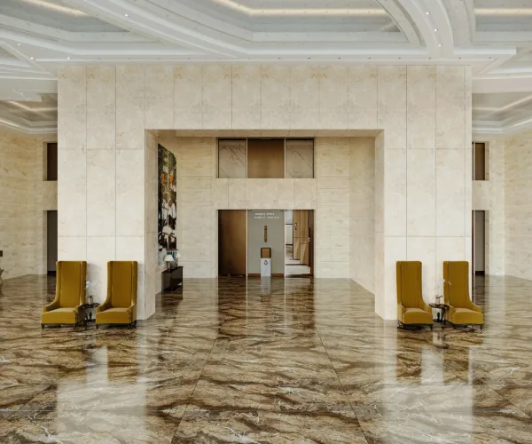 Khu vực sảnh chờ khách sạn thêm phần sang trọng đẳng cấp nhờ vào hiệu ứng của đá nung kết giúp mở rộng không gian